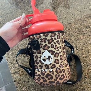 Neon peach hydro jug with neoprene leopard sleeve